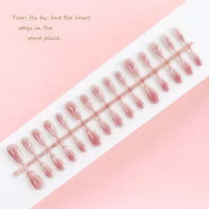 Detailed close-up of 30pcs blush cat-eye press-on nails set with shimmer effect