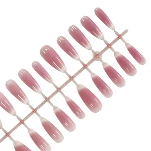 Long almond blush cat-eye press-on nails featuring a soft pink French gradient