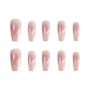 Macro detail of pink blush cat-eye press-on nails featuring a high-gloss shimmering finish