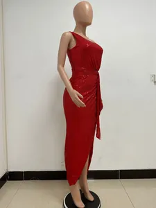 Detailed side view of a red one-shoulder sequined long dress with pleated waist