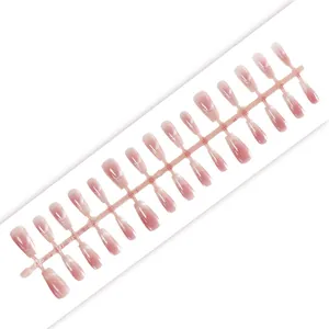 Detailed view of 30pcs pink blush cat-eye DIY press-on nail tips on plastic runner