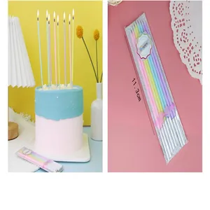 Detailed view of 8 slim macaron-colored birthday candles with 11.3cm size marking.