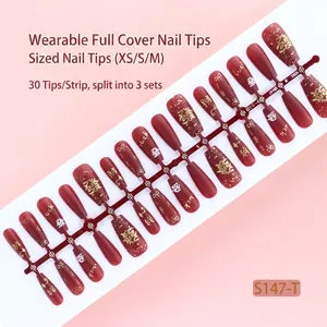 Red matte press-on nail set of 30 with gold lucky patterns and lettering