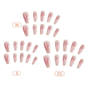 Pink blush cat-eye press-on nails in French style showing various sizes XS, S, and M