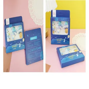 Astronaut and spaceship themed cake candle set in a decorative blue gift packaging box