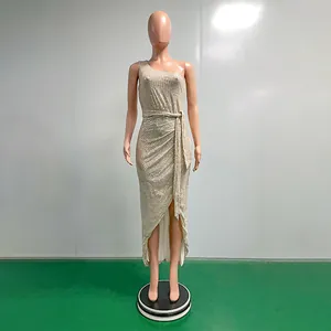 Close-up of a one-shoulder sequined evening gown with ruched waist and tie detail