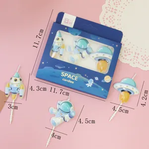 Decorative astronaut and rocket space-themed cake candles with size measurements
