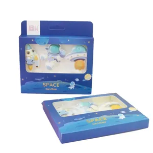 Space themed astronaut and rocket birthday cake candles set in blue gift box packaging