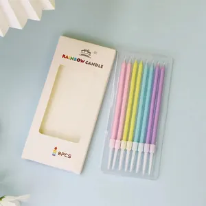 Set of 8 slim rainbow pencil birthday candles for vibrant cake decorations in box
