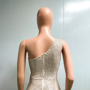 Detailed back view of an elegant champagne one-shoulder sequin dress with zipper