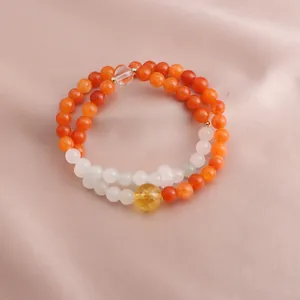 Detail showing orange and white stone beads with a yellow citrine crystal focal bead