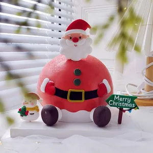 Detail view of a cute Santa Claus and snowman soft rubber cake topper for Christmas.