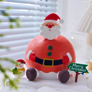 Close-up of Santa Claus and snowman soft glue cake toppers for Christmas decor