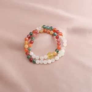 Detail of a double-strand bracelet with colorful jade and citrine beads