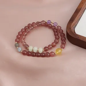 Close-up of double-strand bracelet with strawberry quartz, sunstone and amethyst beads