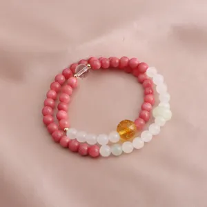 Macro detail showing the texture of a double-loop natural stone bracelet with citrine
