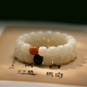 Bracelet de perles de prière en racine de Bodhi naturelle avec perle d'accent décorative.