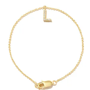 Minimalist gold chain bracelet featuring a sparkling zircon initial letter L charm pendant