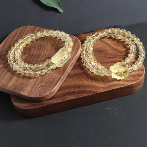 Detailed view of natural citrine double-layer bracelets with fox and flower carvings