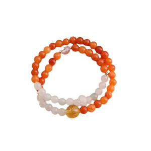 Handmade double-layered beaded bracelet featuring natural orange stones and citrine bead.