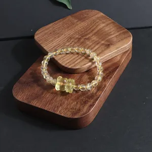 Detailed close-up of natural citrine lemon quartz bracelet featuring a carved fox charm