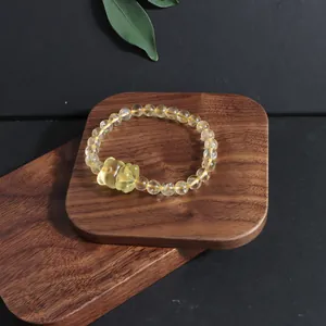 Detailed view of natural yellow citrine beaded bracelet with a cute fox charm accessory
