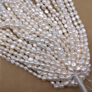Close-up of 4-8mm white baroque irregular freshwater pearls for DIY jewelry making.