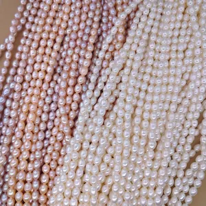 Hilos de perlas de arroz naturales de agua dulce blancas y rosas, perlas de 5-9 mm.