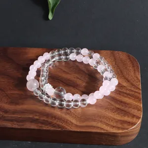 Macro detail view of double-strand pink rose quartz and clear crystal beaded bracelet