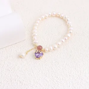 Detailed view of natural pearl bracelet featuring a purple heart zircon pendant