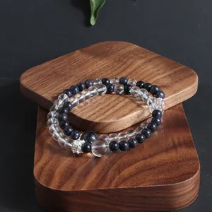 Close-up of double-layer natural stone bracelet with blue goldstone and clear crystal beads
