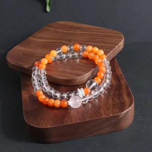 Close-up of double-layer natural crystal bracelet with sunstone and clear beads