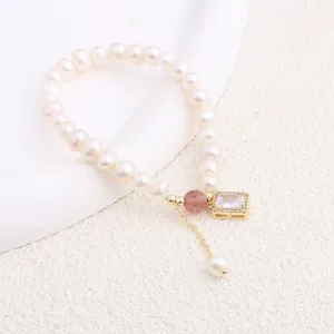Elegant detailed view of natural freshwater pearl bracelet with a gold rectangular zircon charm.