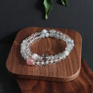 Close-up detail of a double-layered natural stone bracelet with labradorite and clear quartz beads