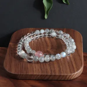 Detail of double-layer natural crystal bracelet with labradorite and quartz beads