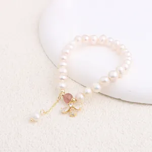 Close-up of natural freshwater pearl bracelet with exquisite zircon bee pendant