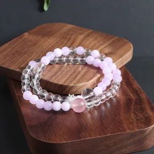 Detailed close-up of double-layered natural pink and clear crystal stone bead bracelet