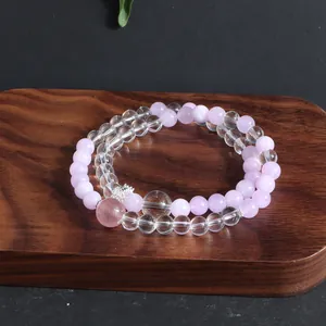 Detailed view of a double-strand natural crystal bracelet with lavender and clear beads.