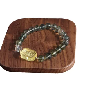Elegant green phantom crystal bracelet with hand-carved yellow lion charm for women