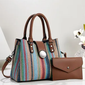 Casual 2-piece bag set featuring a colorful woven stripe tote and brown leather wallet.