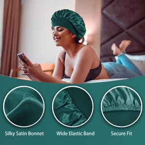 Close-up detail view of dark green silky satin sleep bonnet featuring a wide elastic band