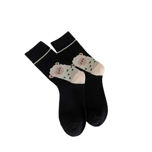 Chaussettes mi-hautes noires avec motif mouton mignon et pointe de couleur crème pour femme