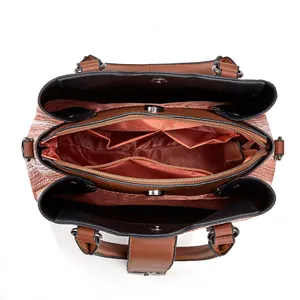 Detailed top view of the spacious handbag interior with multiple compartments and lining