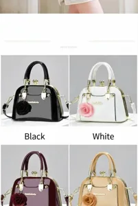 Borse a mano lucide in nero e bianco con eleganti ciondoli a forma di rosa.