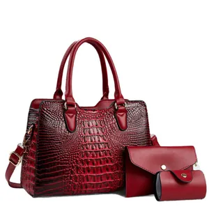 Elegant 3-piece red crocodile pattern handbag set including crossbody shoulder bag