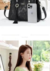 Elegant black textured handbag with tassel detail shown with a model and scale reference