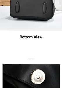 Detailed close-up of a black handbag's textured leather and magnetic snap closure.
