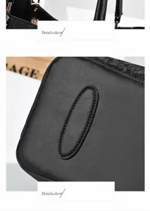Detail of black handbag showing comfortable handle and protective bottom pads
