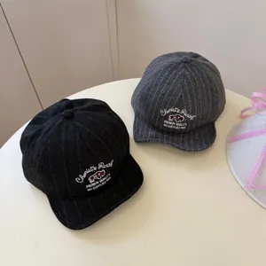 Vintage pinstripe flat brim baseball cap with rhino embroidery detail.