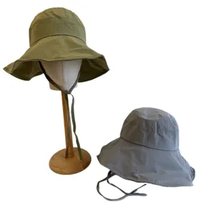Stylish wide-brim bucket hats with small check pattern and adjustable chin straps